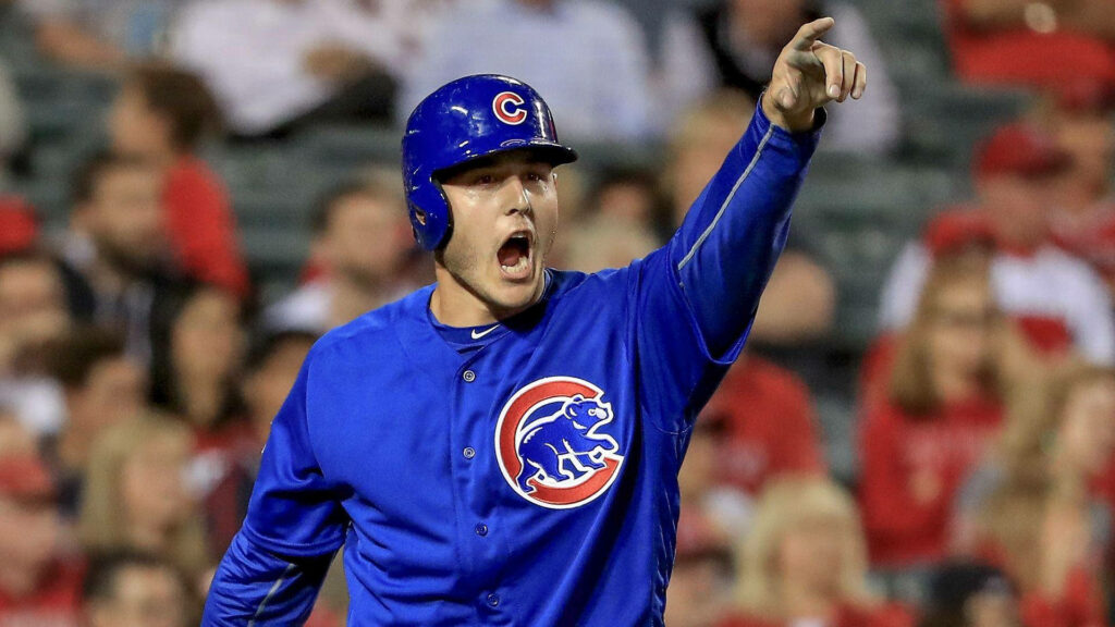 Anthony Rizzo shouting and pointing in Chicago Cubs uniform during intense baseball game action Wallpaper
