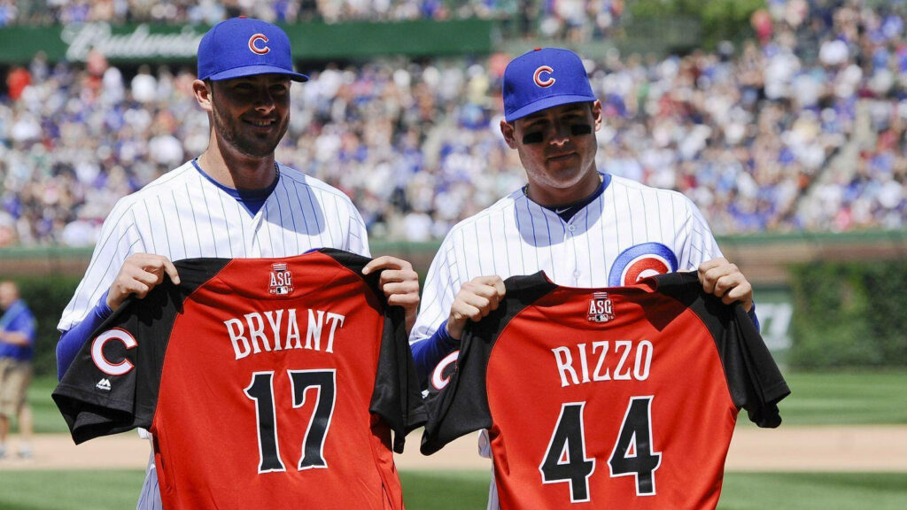 Anthony Rizzo and Kris Bryant holding All Star Game jerseys celebrating Chicago Cubs selection Wallpaper