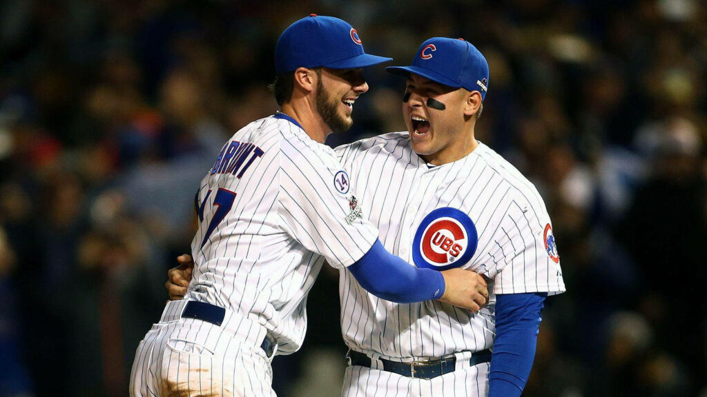 Anthony Rizzo and Bryant celebrate on field in Chicago Cubs uniforms showing teamwork joy Wallpaper