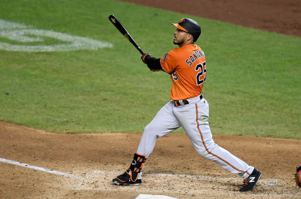 Anthony Santander focused on powerful hit during baseball game dynamic wallpaper background