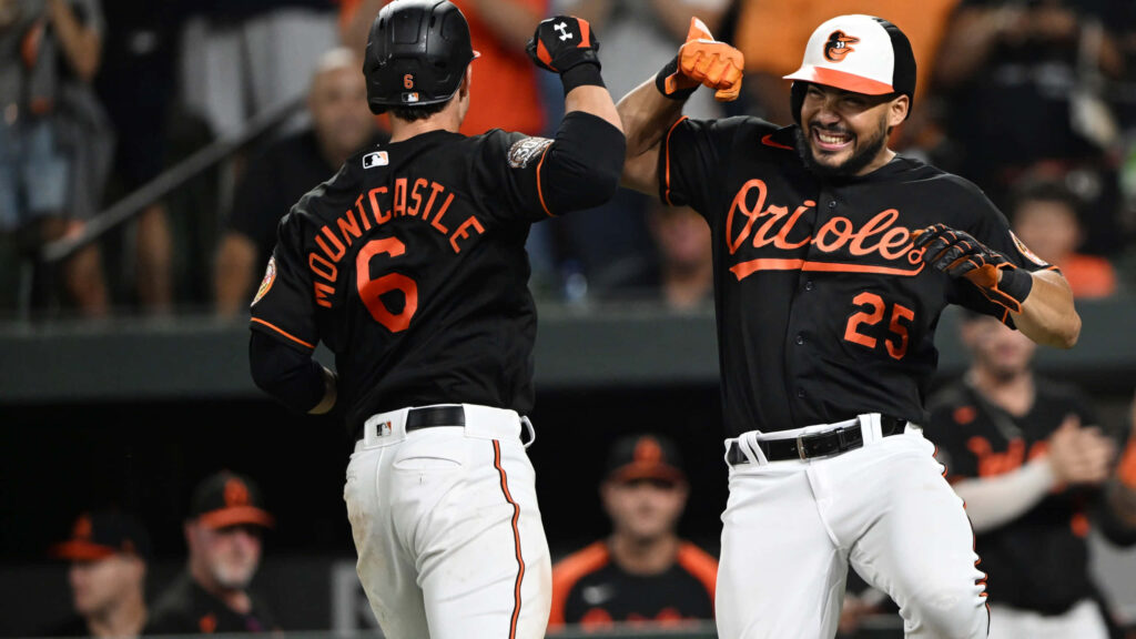 Anthony Santander Orioles celebrating victory with teammate energetic dynamic sports wallpaper