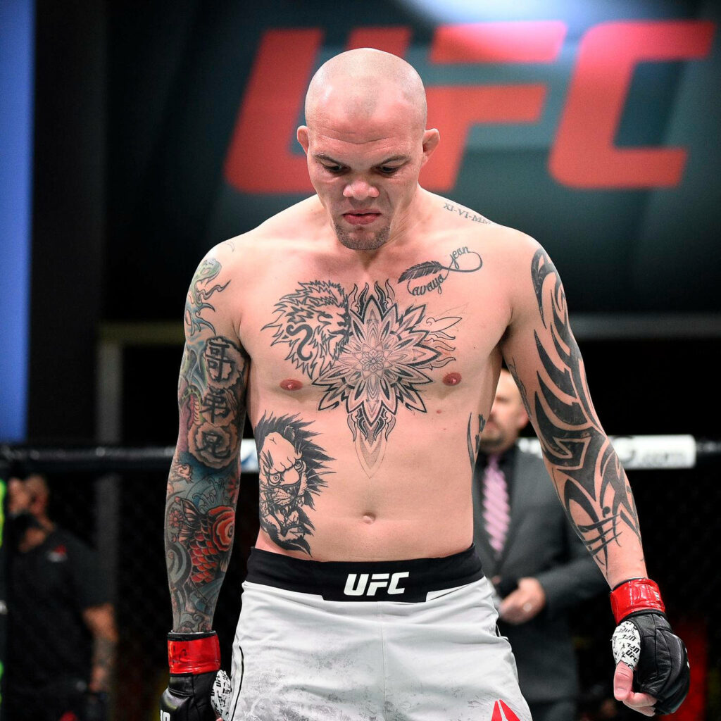 Anthony Smith UFC fighter intense focus tattooed chest inside octagon before fight wallpaper