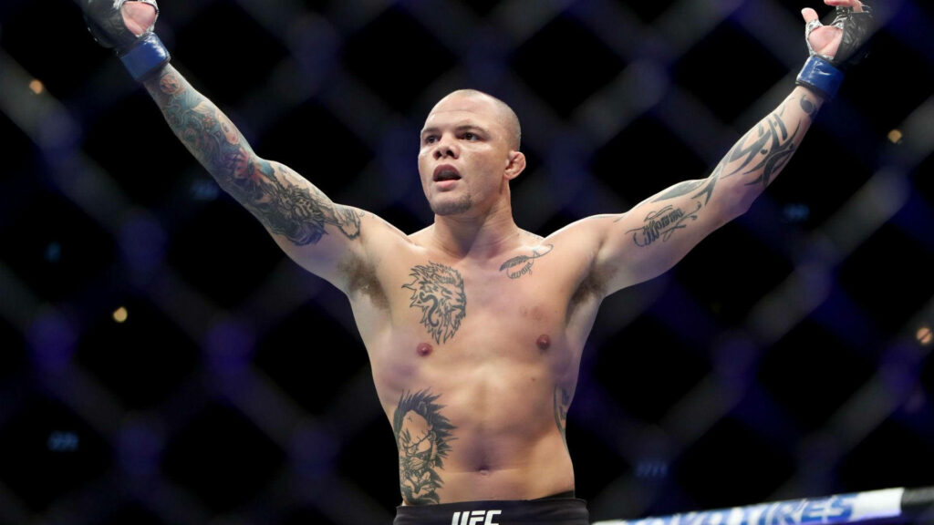 Anthony Smith UFC octagon victory pose showing tattoos intense focus dynamic wallpaper background