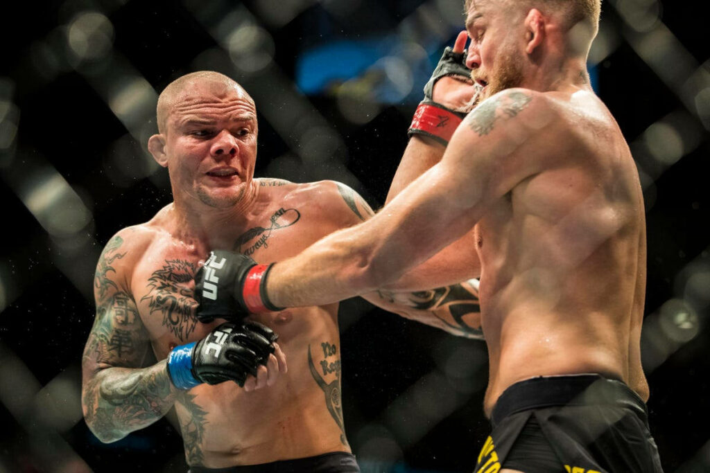 Anthony Smith and Alexander Gustafsson intense UFC faceoff closeup showing fierce determination Wallpaper