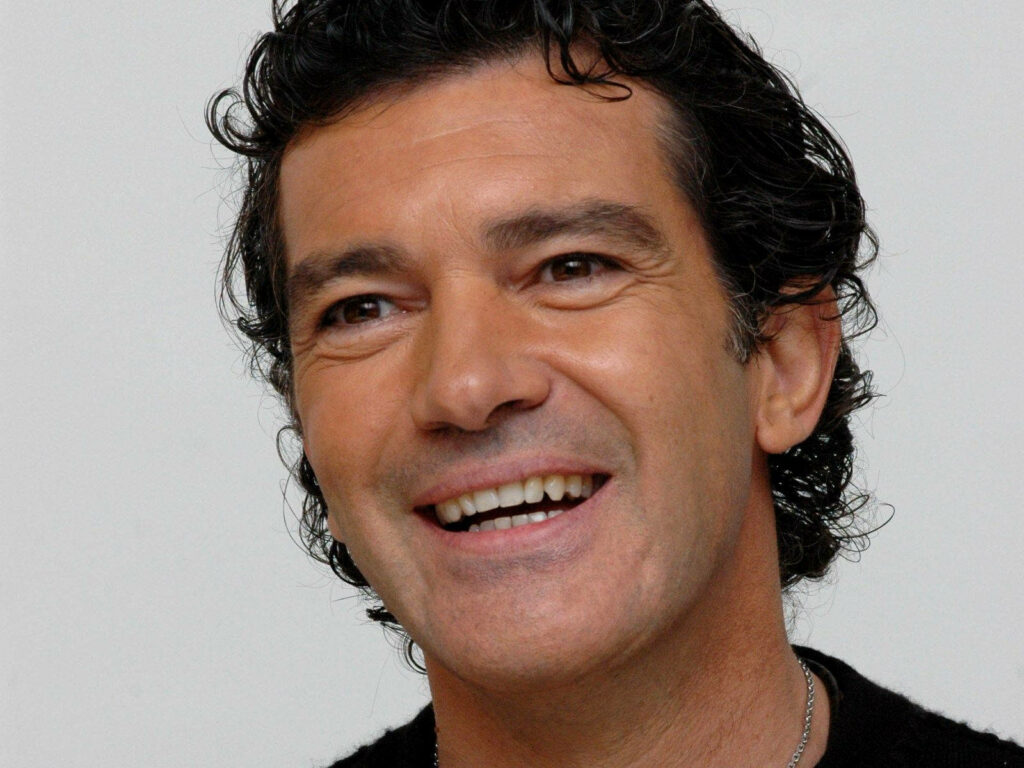 Antonio Banderas warm smile high-resolution wallpaper capturing his Desperado charisma background
