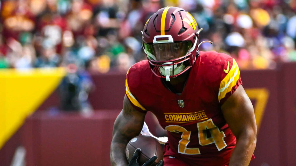 Antonio Gibson running down the field in Washington Commanders uniform action football wallpaper