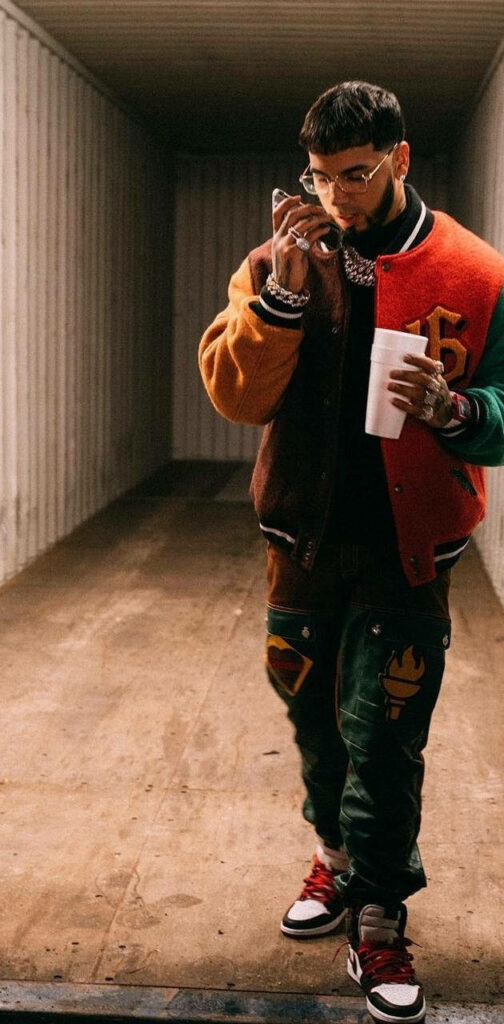 Anuel AA's Trendy Varsity Jacket Outfit - Stylish Fashion Wallpaper