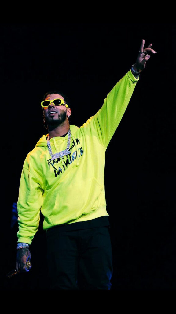 Anuel AA's Energetic Performance in Neon Green Jacket Wallpaper