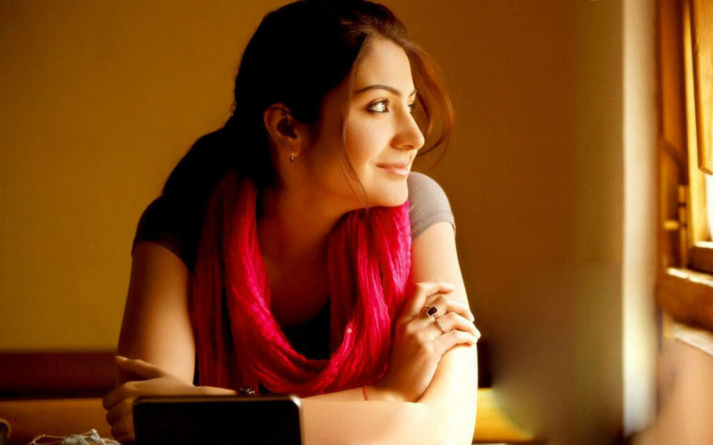 Anushka Sharma serene side profile by window with soft natural light calm wallpaper background