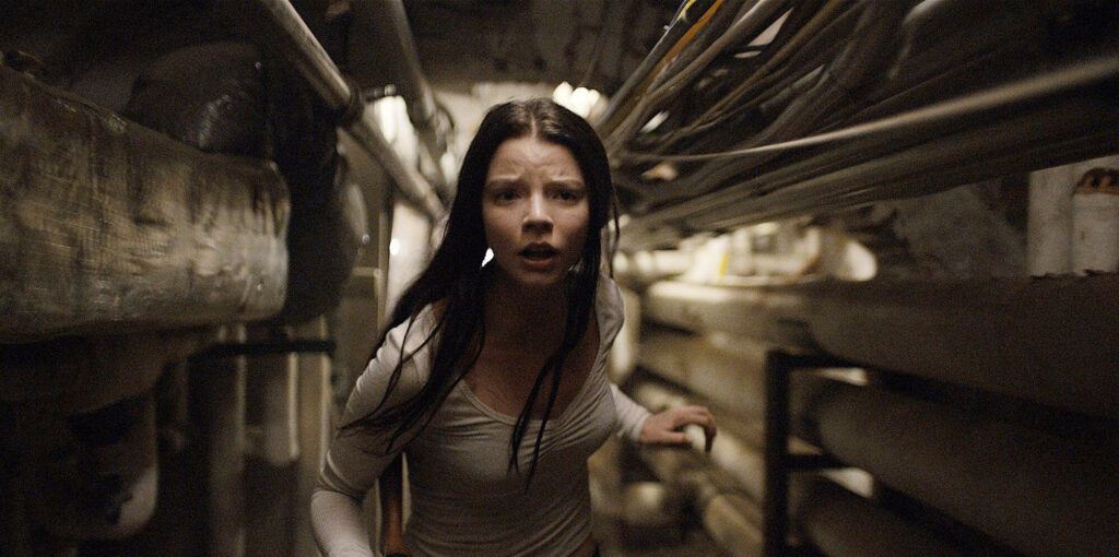 Anya Taylor-Joy tense scene running dimly lit industrial corridor Split movie wallpaper background