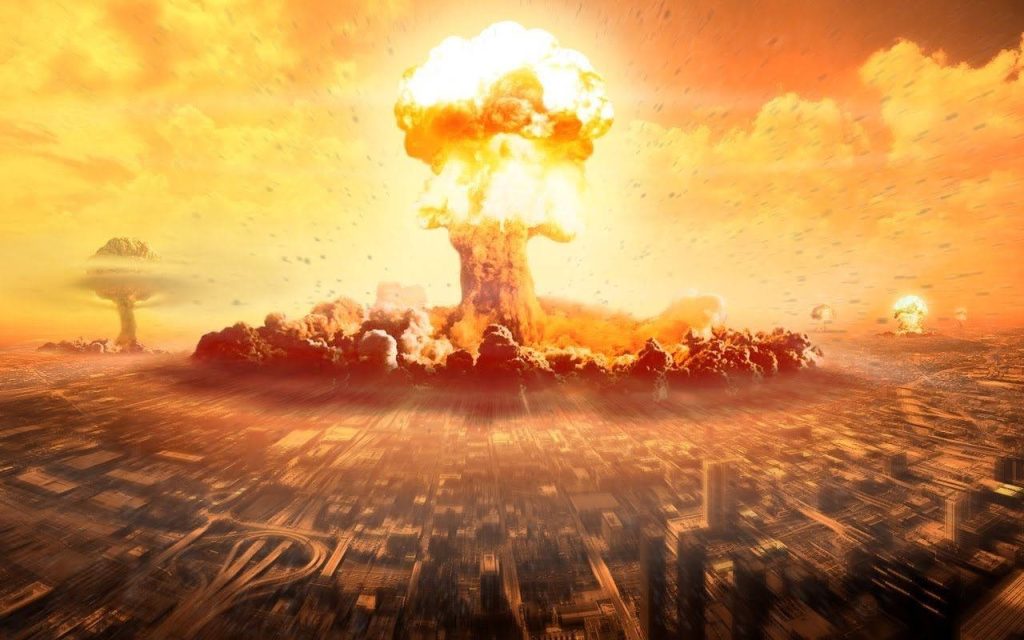Fiery mushroom cloud over city skyline with nuclear blasts in intense apocalyptic scene wallpaper