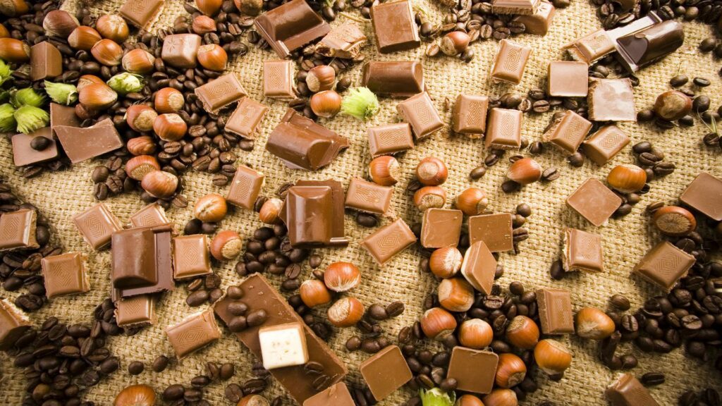 Chocolate, Hazelnuts & Coffee Beans Wallpaper on Burlap Background