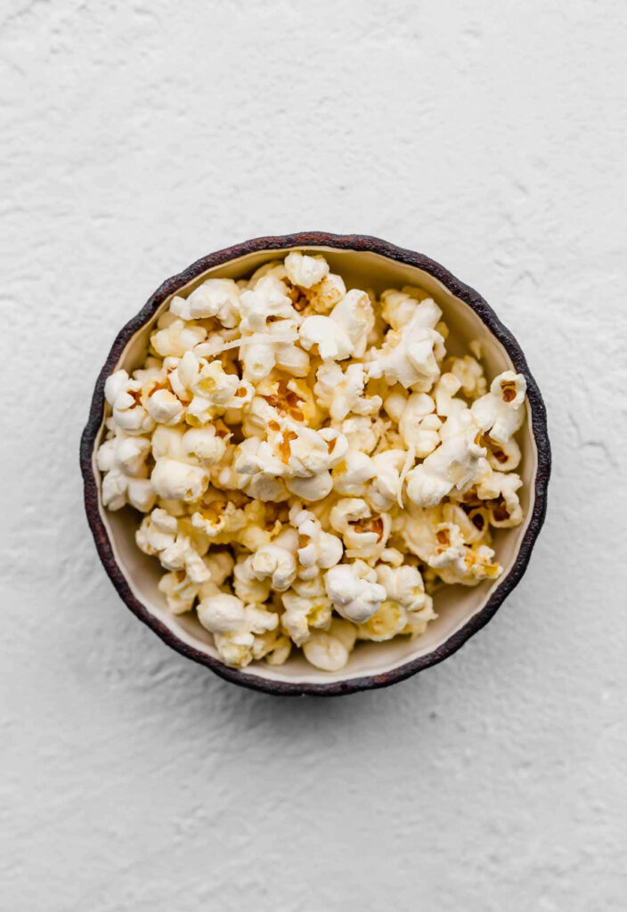 Appetizing Popcorn Wallpaper: Freshly Popped on White Background