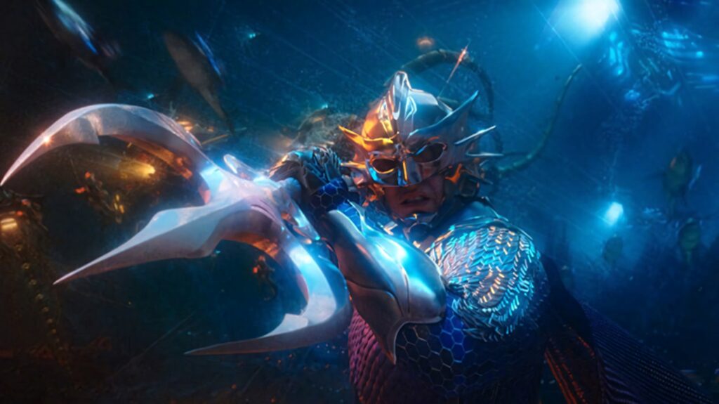 Aquaman in detailed battle armor holding iconic trident in intense underwater movie scene wallpaper