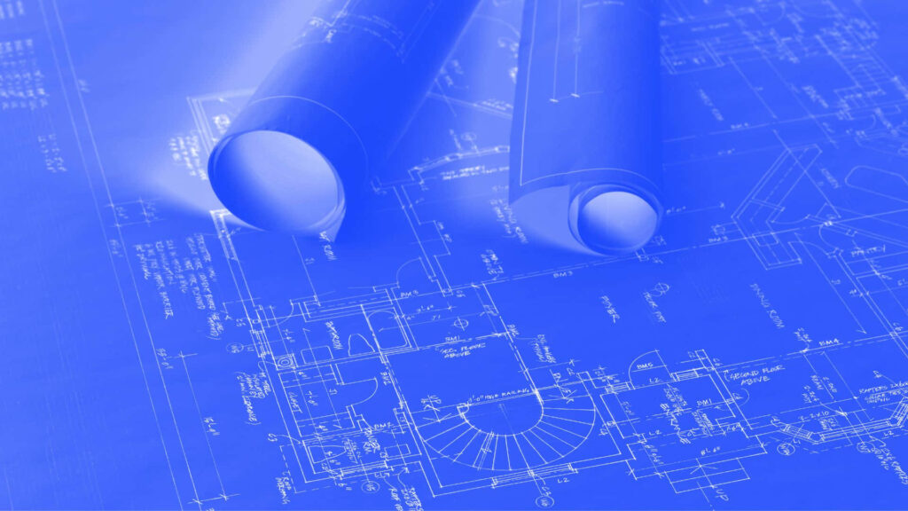 Architectural blueprint rolls on technical floor plans showcasing precise design creativity background Wallpaper
