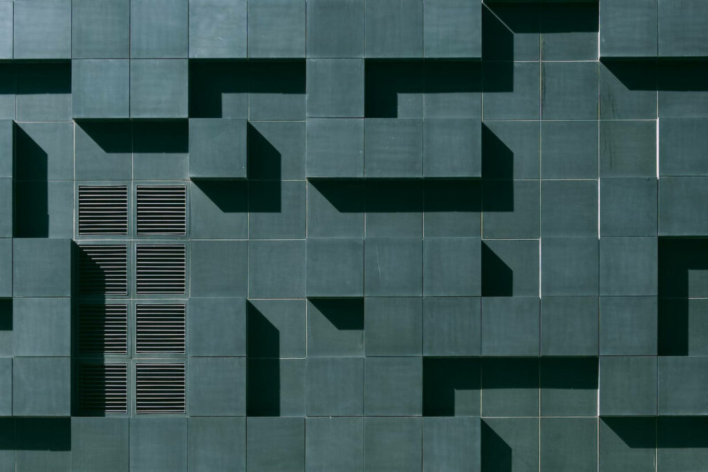 Captivating Convergence: A Striking Monochrome iPhone Wallpaper Featuring a Geometrically Designed Concrete Structure