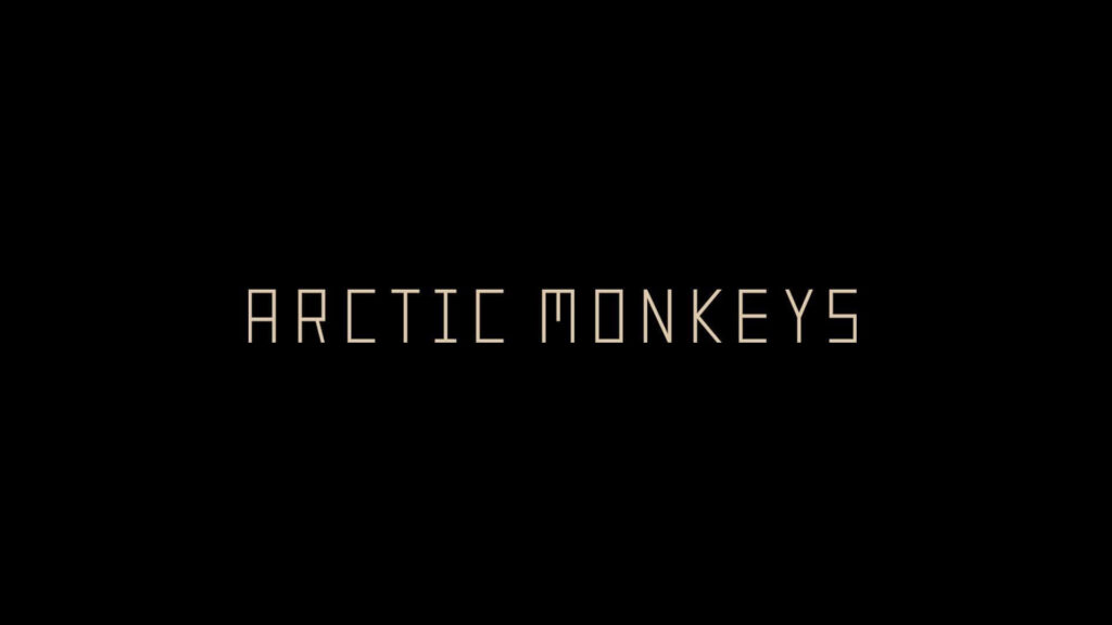 Arctic Monkeys wallpaper with sleek modern text on black background iconic rock band design