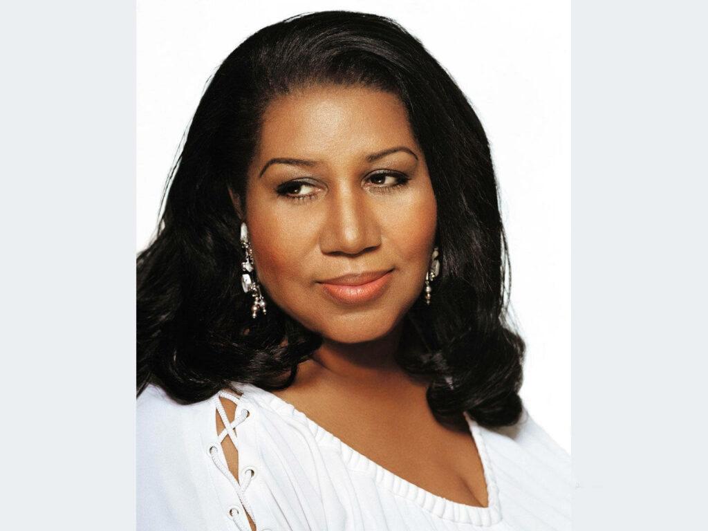 Classic Aretha Franklin 1967 portrait showing soulful elegance and timeless style on white background Wallpaper