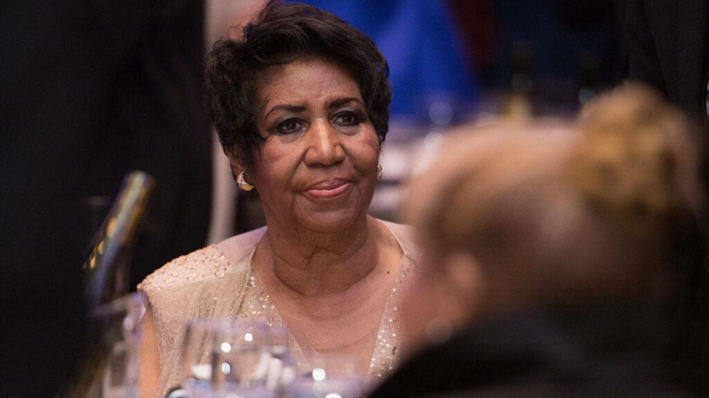 Aretha Franklin elegant event portrait wallpaper background showcasing iconic singer-songwriter