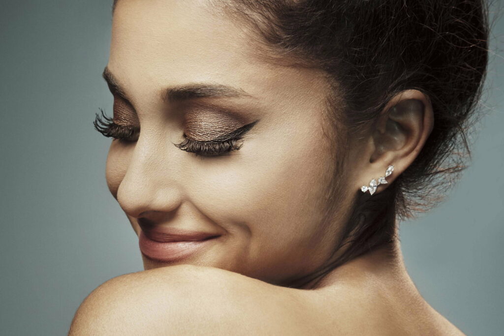 Glamorous Melodies: Captivating Ariana Grande in a Stunning HD Wallpaper Background