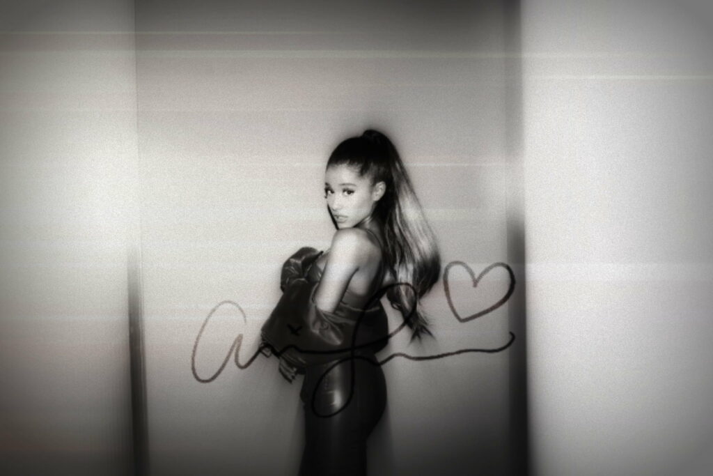 Ariana Grande's Stunning HD Wallpaper: A Captivating Background of the Pop Icon