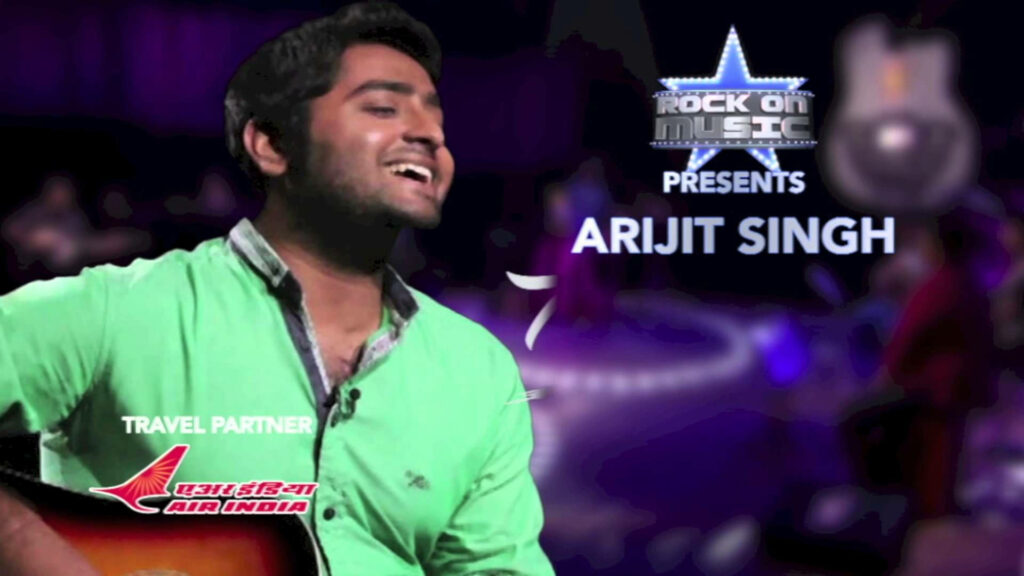 Arijit Singh passionately singing on stage at Rock Of Music contest vibrant musical background Wallpaper