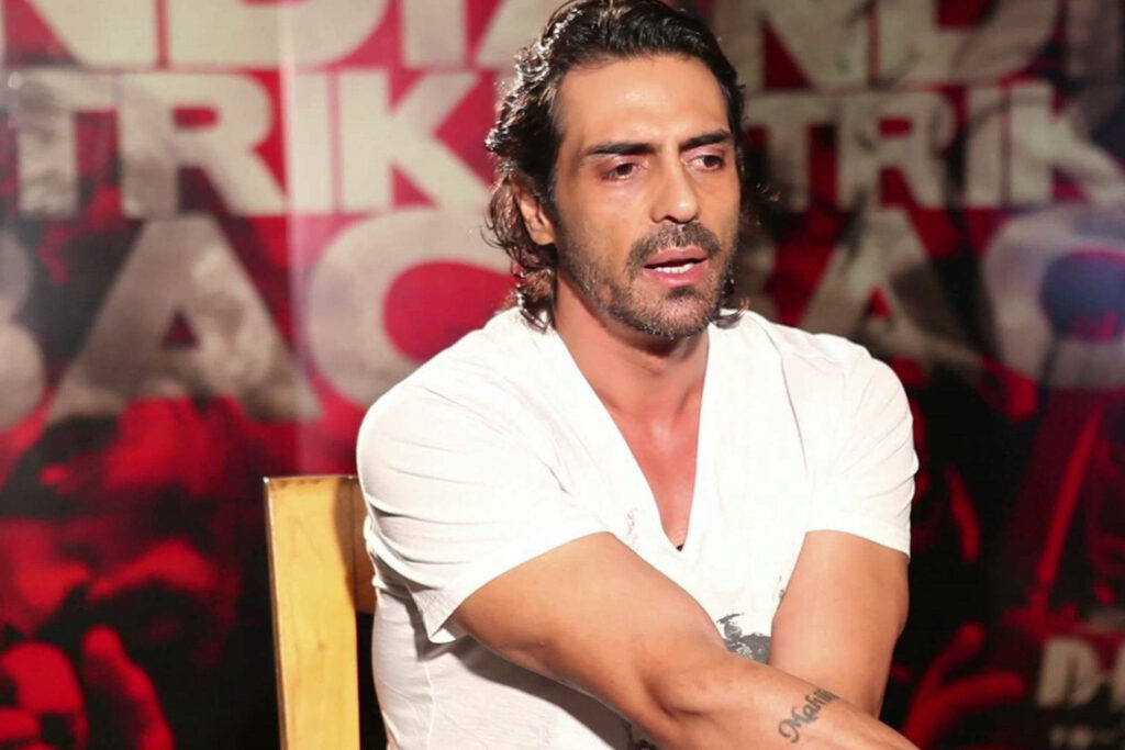 Arjun Rampal candid interview shot sitting casual bold graphic wallpaper background