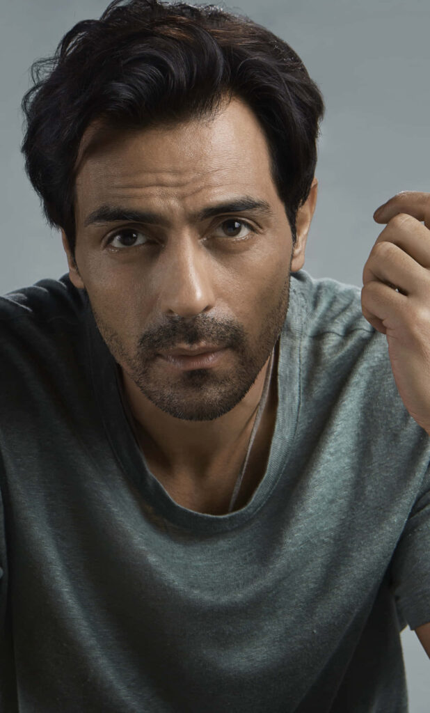 Arjun Rampal wallpaper with intense gaze casual grey t-shirt charismatic Indian actor background
