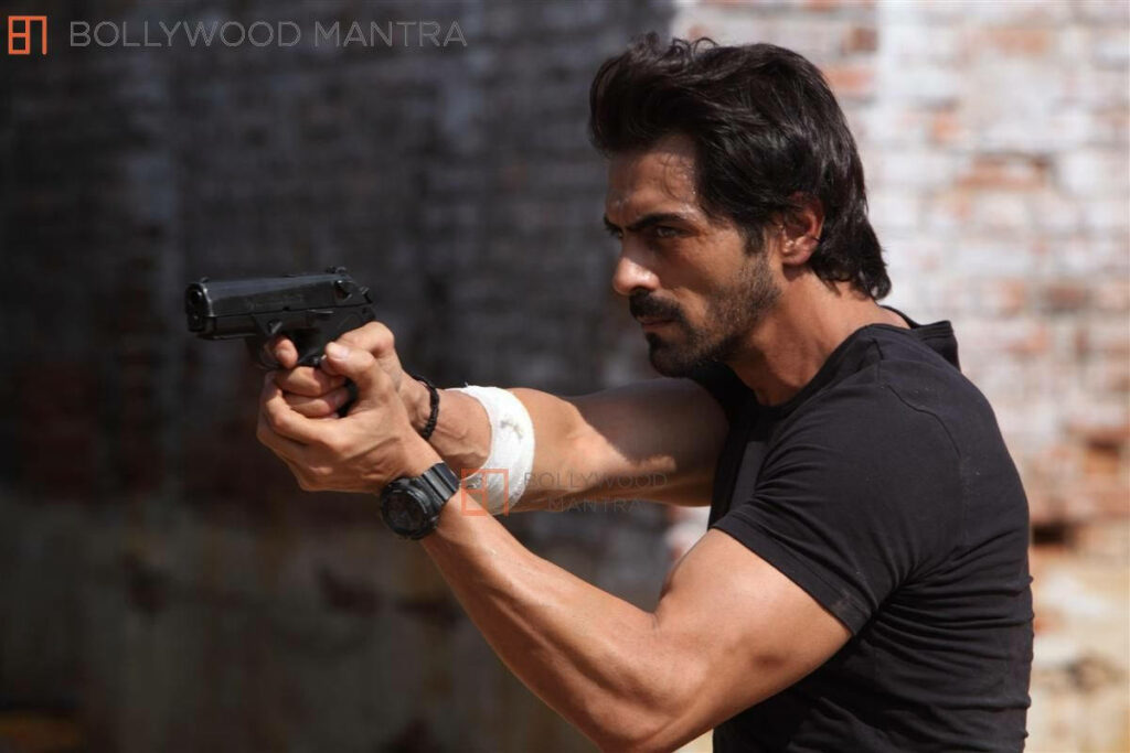 Arjun Rampal intensely aiming gun wearing black t shirt focused strong look dynamic wallpaper