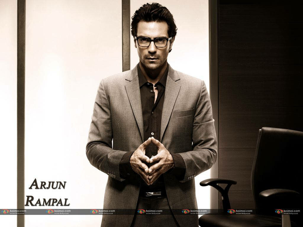 Arjun Rampal sharp suit Bollywood charm wallpaper stylish modern backdrop commanding presence