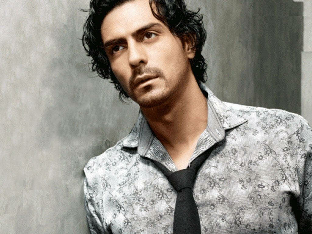 Arjun Rampal charming in patterned shirt black tie textured cool toned wall wallpaper background