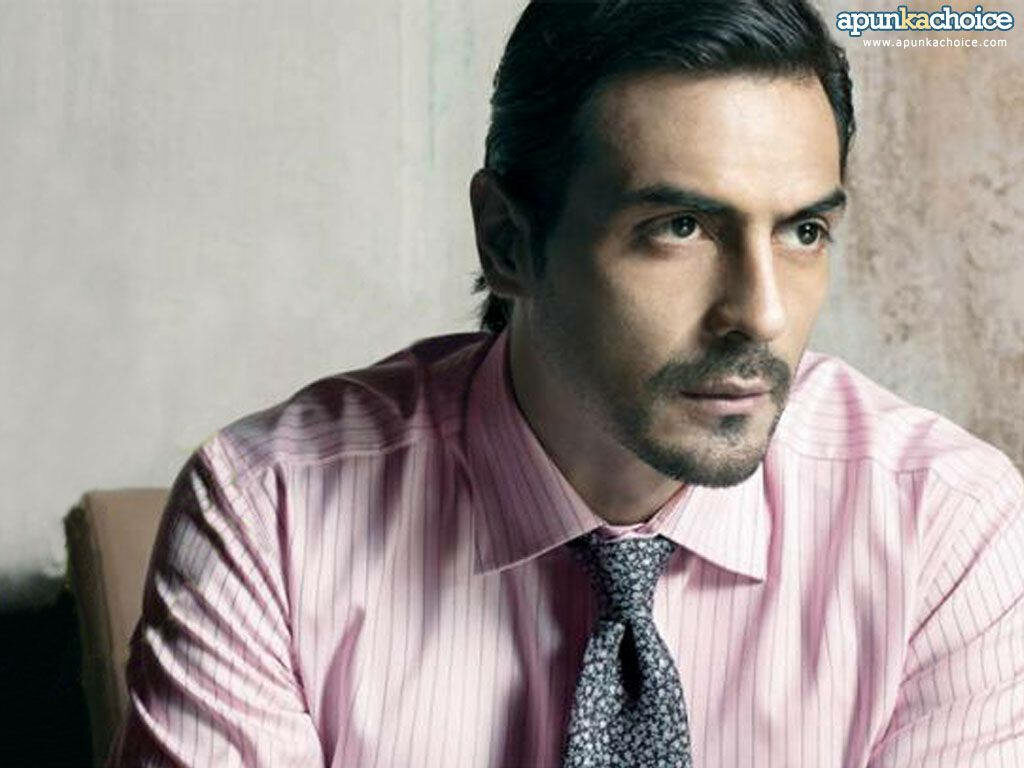 Arjun Rampal in sharp pink shirt patterned tie intense thoughtful expression professional photoshoot Wallpaper