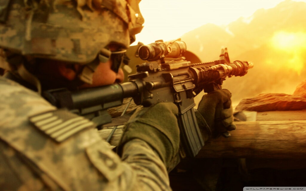 Warrior's Arsenal: A HD Wallpaper Showcase of Elite Soldier Armed with a Black Assault Rifle