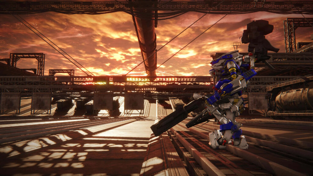 Armored Core mech ready for battle at sunset with industrial structures intense showdown wallpaper