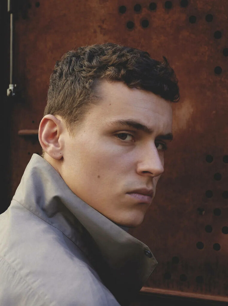 Arón Piper intense serious look moody background strong features confident wallpaper portrait