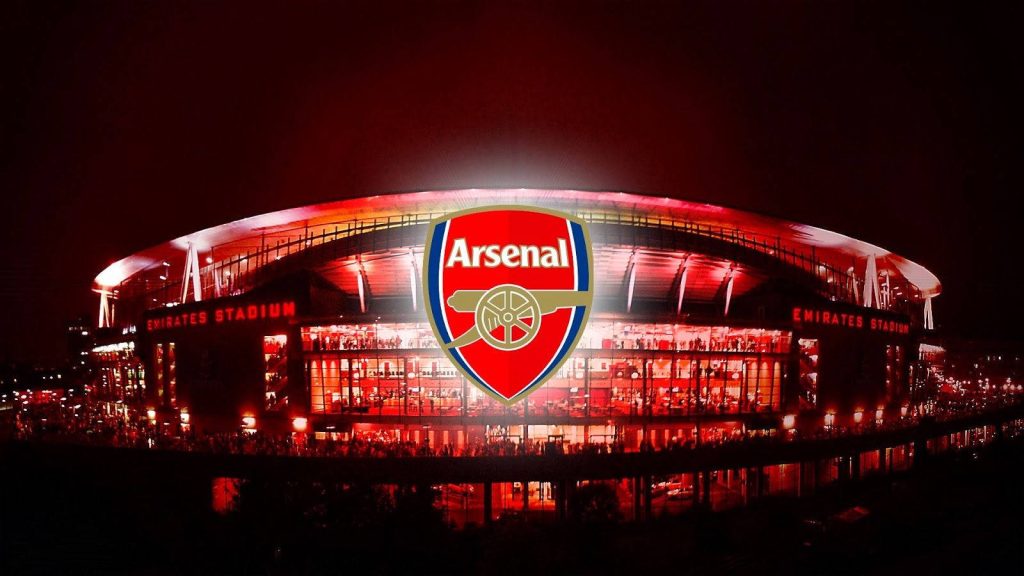 Arsenal FC wallpaper Emirates Stadium glowing red with club crest vibrant night background