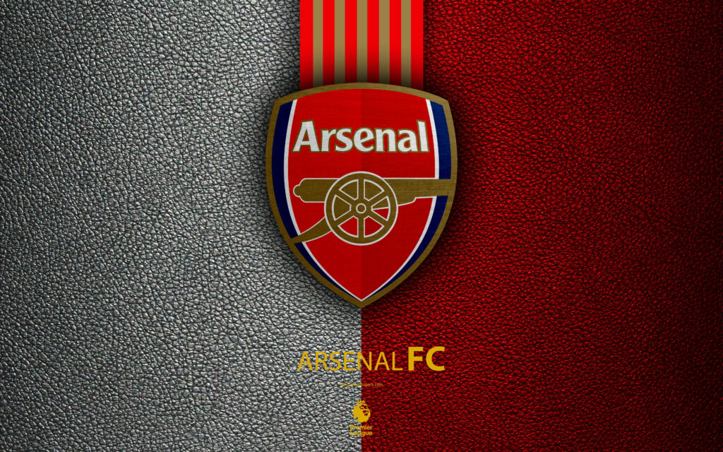 Arsenal FC logo on textured leather background split grey and red showcasing football pride Wallpaper