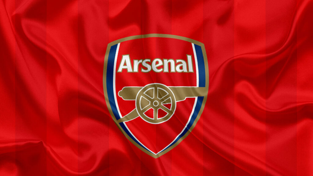 Arsenal flag on red silk wallpaper with bold club crest cannon and gold accents background
