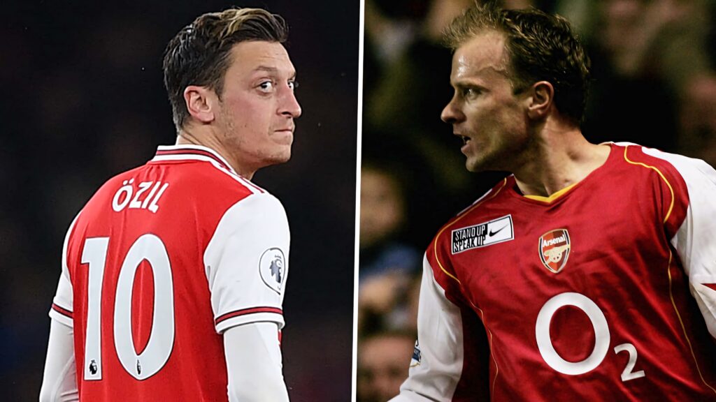 Arsenal legends Mesut Ozil and Dennis Bergkamp in iconic red and white kits with focused expressions Wallpaper