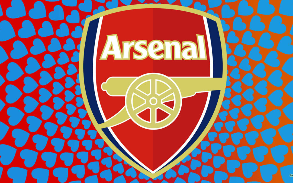 Arsenal logo centered on blue heart pattern wallpaper showing passionate football club love