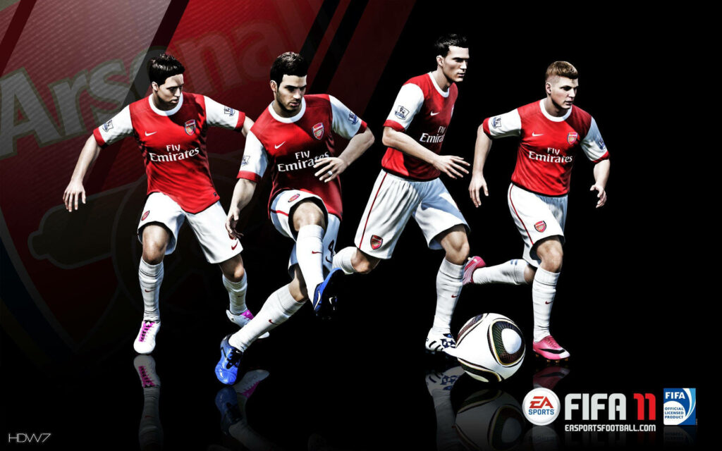 Arsenal Players in Action: Dynamic FIFA 11 Wallpaper for Fans