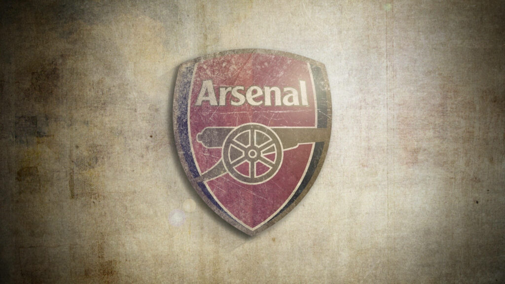 Arsenal logo vintage cannon design on textured grunge brown background wallpaper