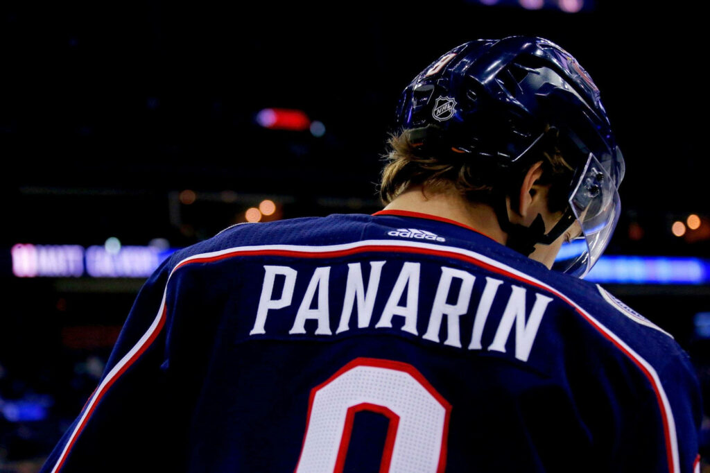 Artemi Panarin Game Wallpaper: Striking Ice Action Background