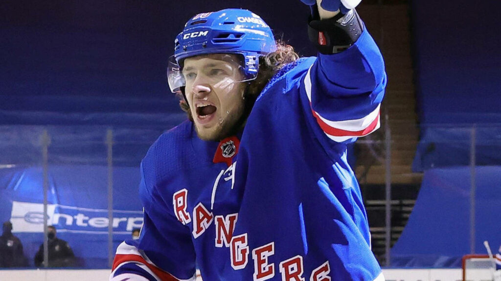 Team Leader Artemi Panarin celebrates on ice wearing New York Rangers jersey hockey spirit wallpaper
