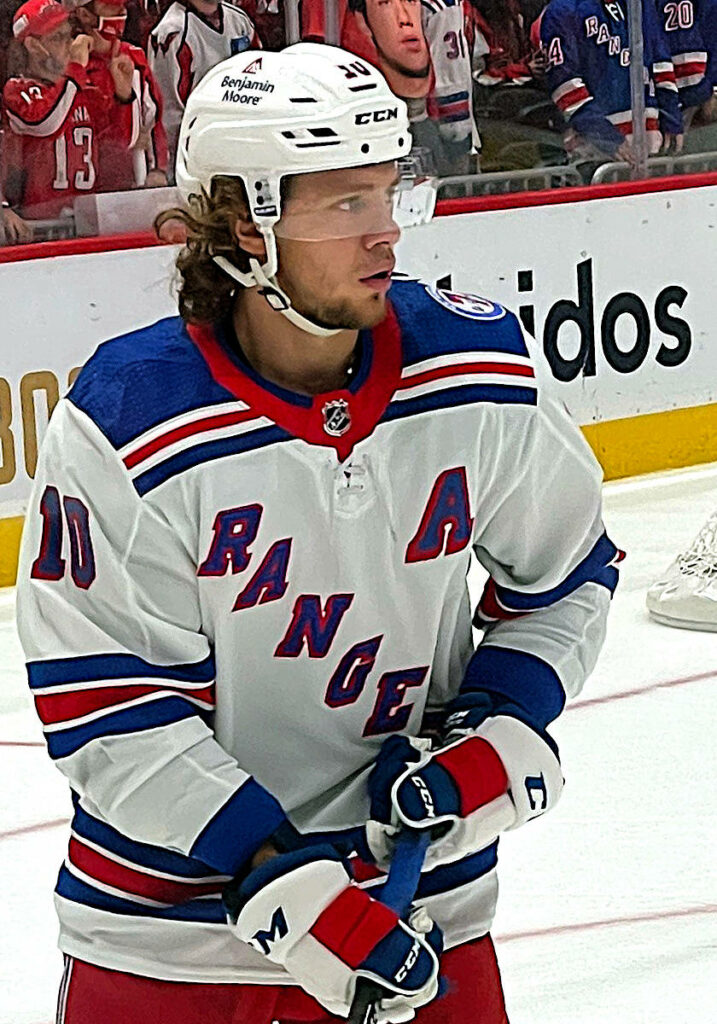 Artemi Panarin New York Rangers hockey player in blue white red uniform during game action wallpaper