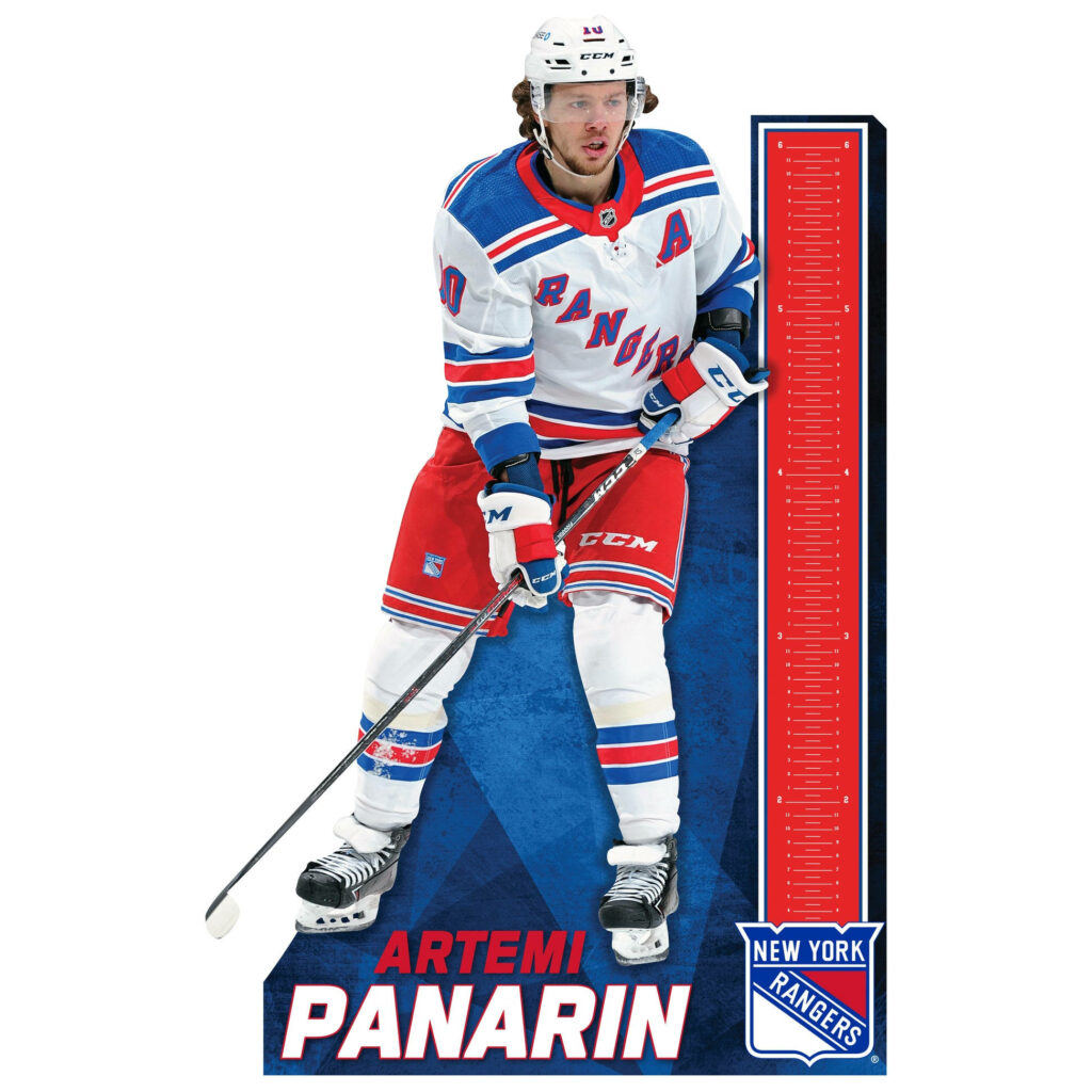 Artemi Panarin New York Rangers winger in official uniform skating dynamically on ice hockey rink Wallpaper