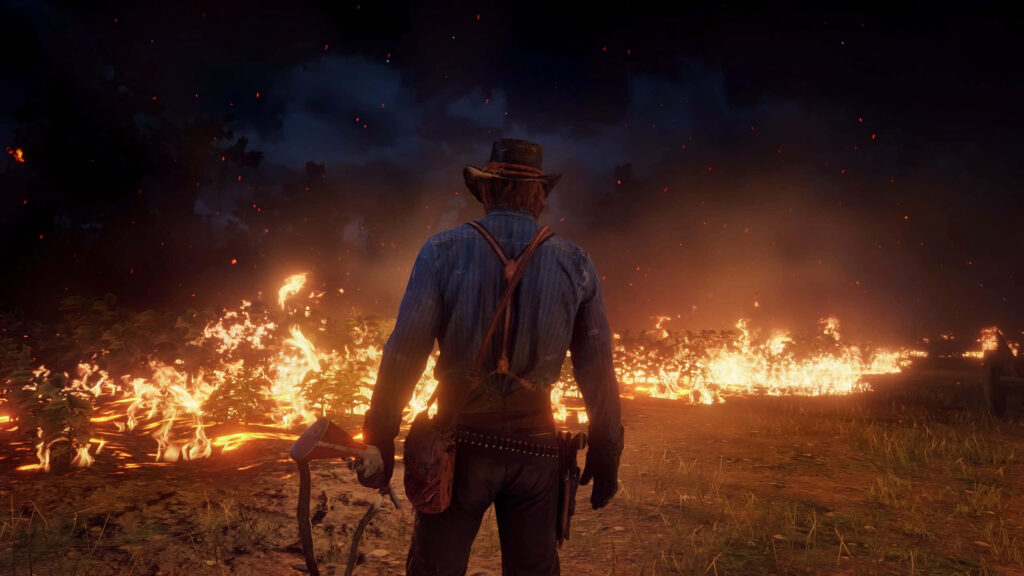 Arthur Morgan watching intense wildfire at night dramatic landscape Red Dead Redemption wallpaper