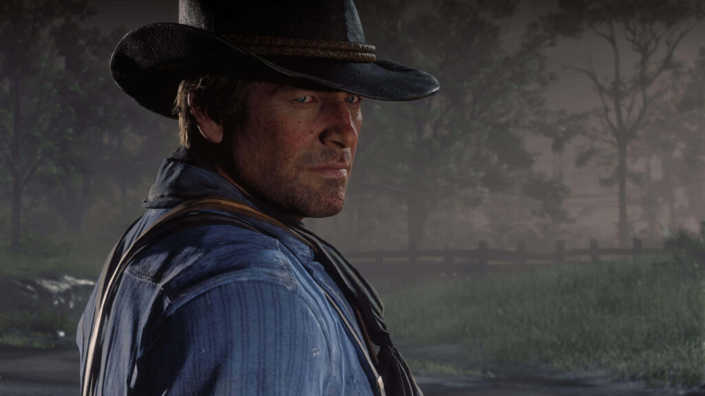 Arthur Morgan Red Dead Redemption 2 in misty landscape wearing hat rugged attire strength determination Wallpaper