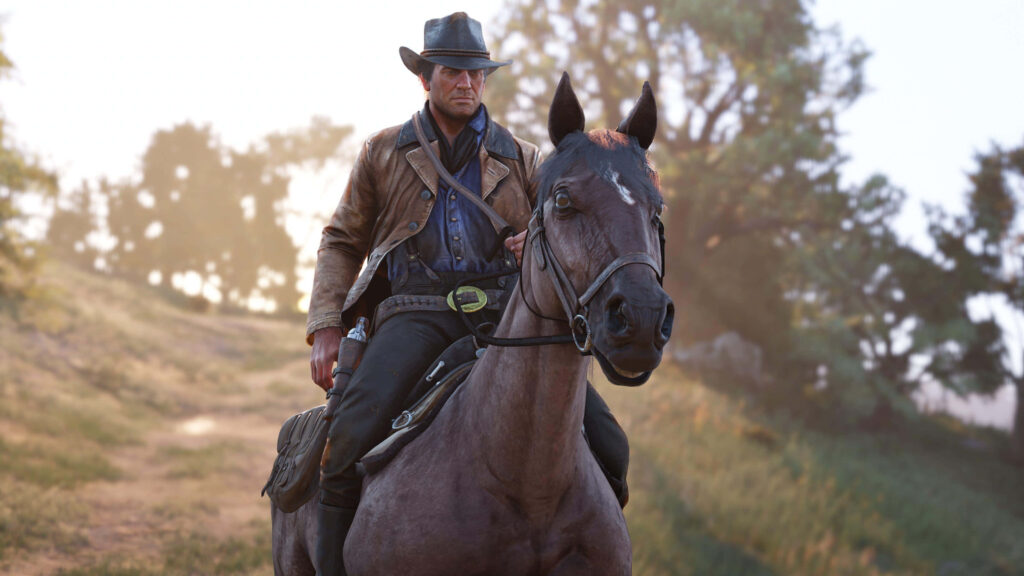 Arthur Morgan riding horse at golden sunset Red Dead Redemption 2 rugged adventurous wallpaper