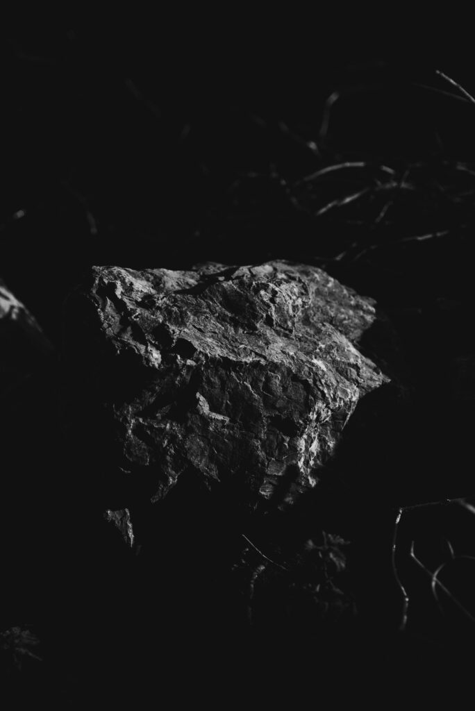 Textured Stone Close-Up: Artistic Black and White Wallpaper Background